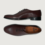Director Wholecut Maroon Leather Shoes For Men - Lateral Side Profile View Showing Sleeve Cut & Athletic Taper Fit