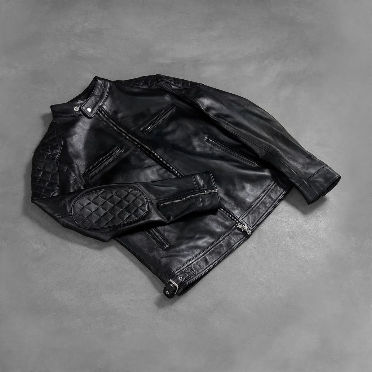 Zipper &amp; Hem Craftsmanship Construction Detail on Men's Gatsby Quilted Black Leather Biker Jacket