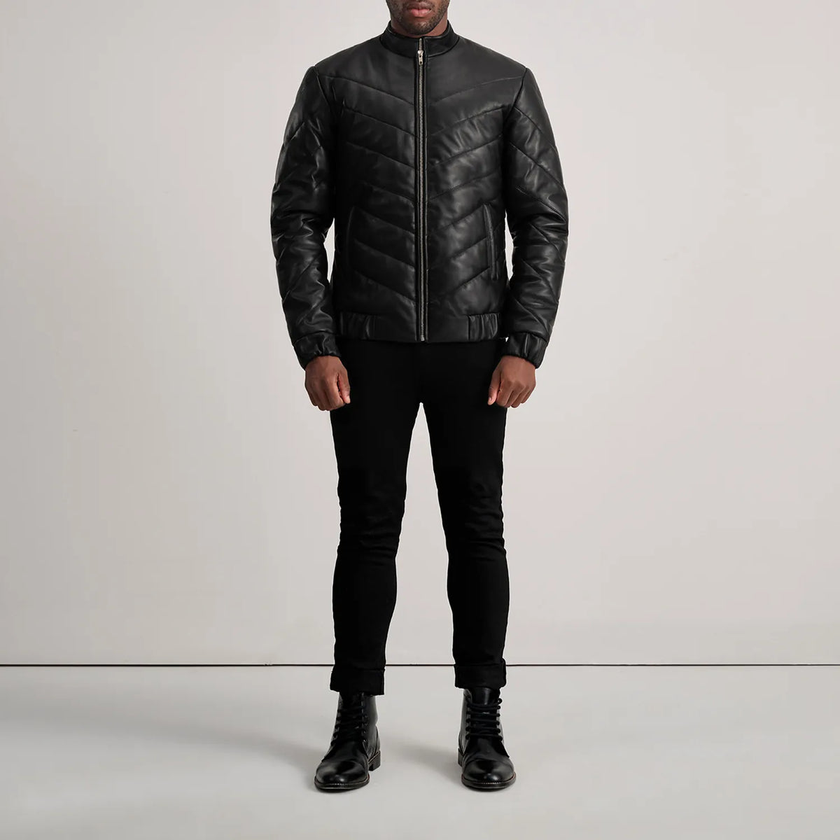 Travis Black Leather Puffer Jacket - Lateral Side Profile View Showing Sleeve Cut &amp; Athletic Taper Fit